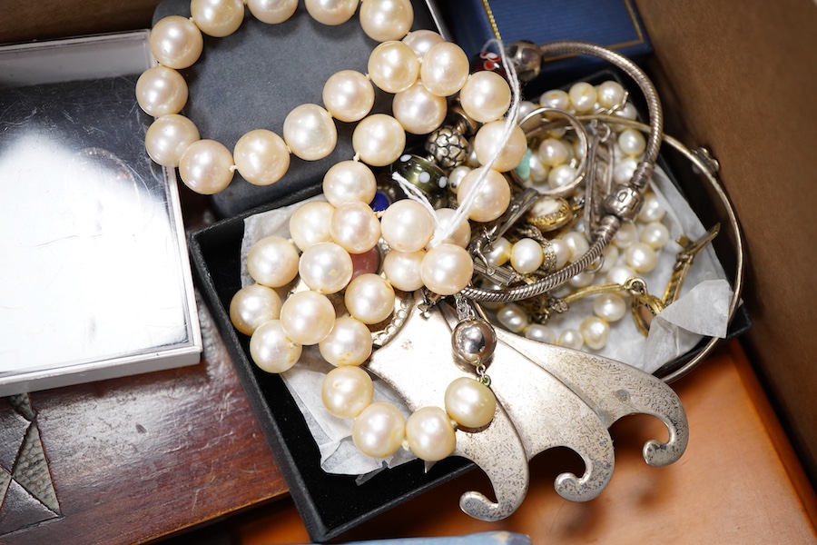 A cultured pearl necklace, composed of graduated cultured pearls of pale pink tint measuring approximately 11-12mm, to a spherical clasp stamped 14K; a black opal measuring approximatley 11 x 7mm, on a display cushion; a
